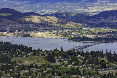 A view of the Kelowna Skyline, Okanagan Lake and the William R Bennett Bridge from Mount Boucherie in West Kelowna British Columbia Canada in the summer